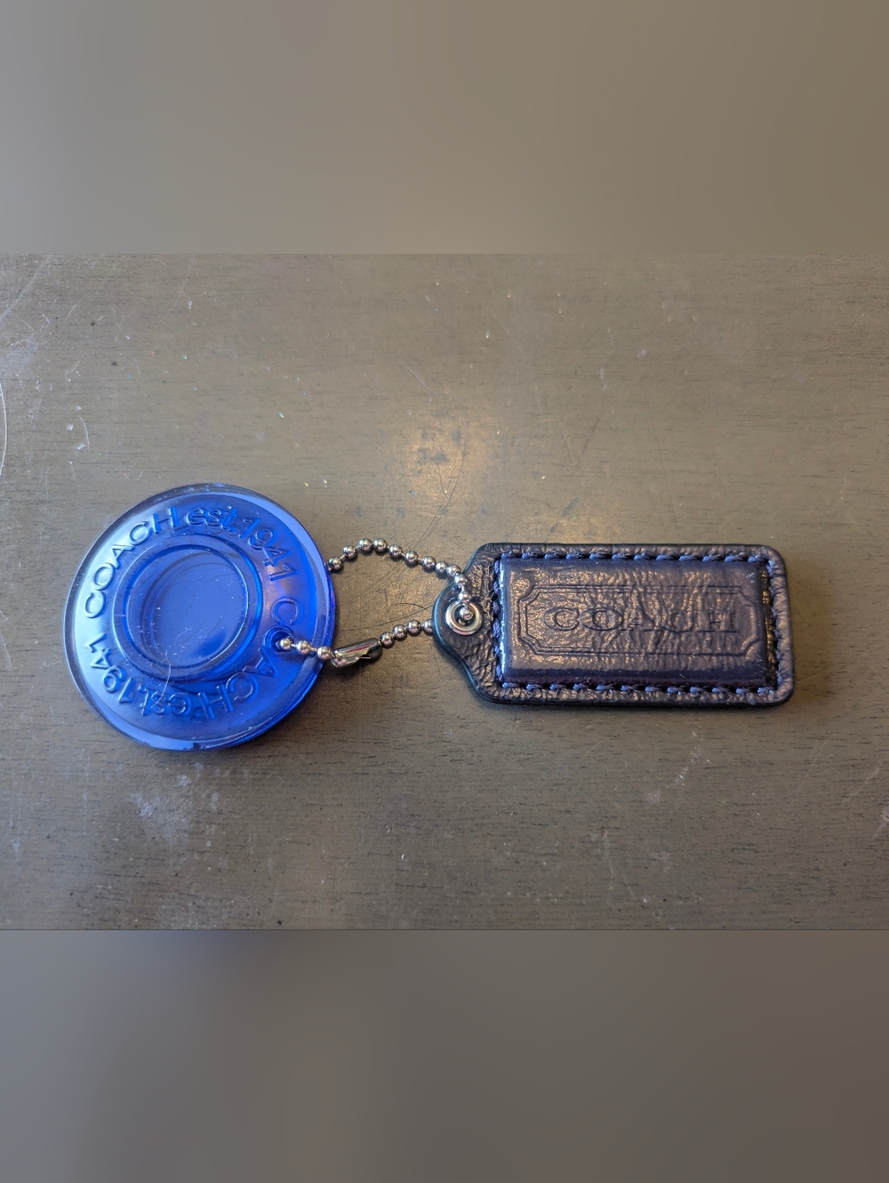 Coach Established 1941 Blue Acrylic Disk With dark blue Coach hang tag